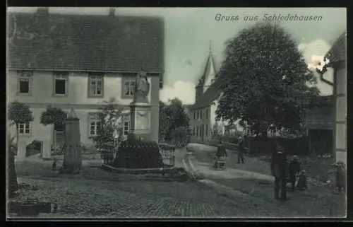 AK Schledehausen / Osnabrück, Ortspartie mit Denkmal und Brunnen