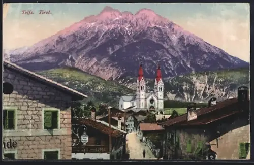 AK Telfs /Tirol, Strassenpartie mit Gasthaus und Kirche