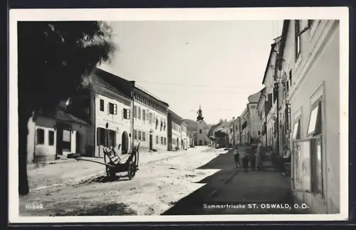 AK St. Oswald /O. D., Strassenpartie mit Geschäften und Kirche, Karren