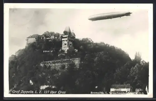 AK Graz, Luftschiff Graf Zeppelin LZ 127 über dem Uhrturm
