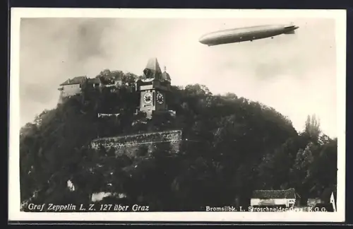 AK Graz, Luftschiff Graf Zeppelin LZ 127 über dem Uhrturm