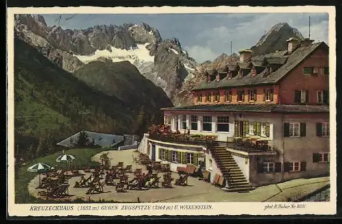 AK Kreuzeckhaus, Die Terrasse der Berghütte gegen Zugspitze und Waxenstein