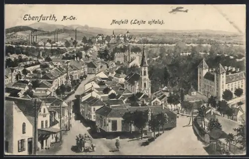 Künstler-AK Ebenfurth, Neufeld, Flugzeug fliegt über den Ort