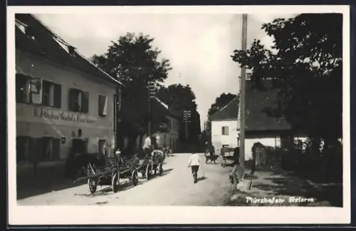 AK Mürzhofen, Strassenpartie mit Grabners Gasthof und Fleischhauerei
