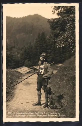 AK Tegernsee, Hubertushütte mit Jäger und Hund