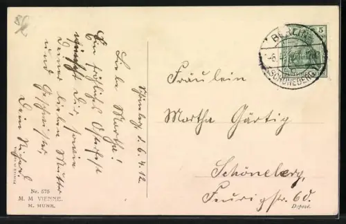 AK Osterengel sitzt mit einem Vogel auf einer Wiese