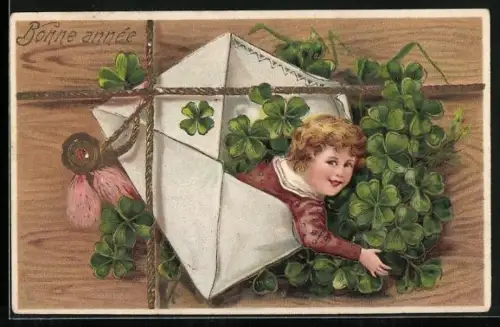 AK Kind mit Glücksklee in einem Briefumschlag, Bonne année