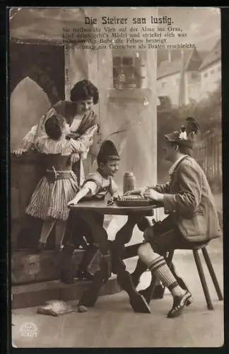 AK Familie bei einem Tisch, Mann spielt Zither
