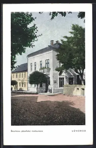 AK Bátyu, Strassenpartie mit Dorfkirche und Teich