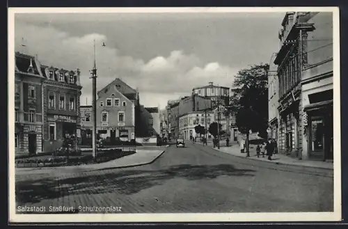 AK Stassfurt, Strasse am Schulzenplatz mit Cafe Wendel