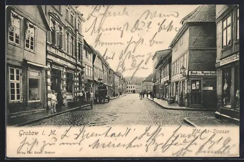 AK Grabow i. M., Markt-Strasse mit Behncke`s Hotel, Buch- u. Papierhandlung