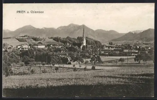 AK Prien a. Chiemsee, Ortsansicht mit Kirche und Bergpanorama