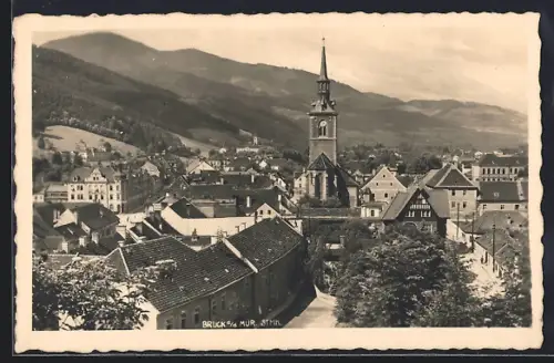 AK Bruck / Mur, Teilansicht mit bewaldeten Hügeln im Hintergrund