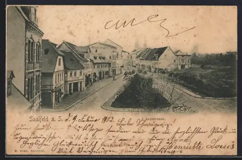 AK Saalfeld a. S., Saalstrasse mit Ofen-Lager und Geschäft von Karl Schlöter