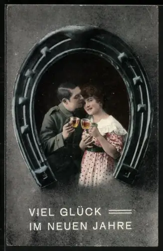 AK Liebespaar gerahmt von einem Hufeisen, Neujahrsgruss