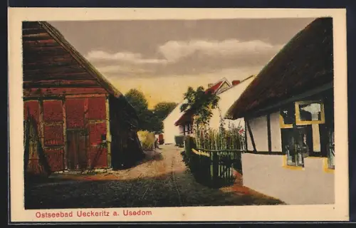 AK Ueckeritz a. Usedom, Dorfstrasse mit Fachwerk- und Reetdachhäusern