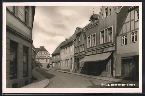 AK Belzig, Sandberger Strasse mit Geschäft von Karl Schmidt