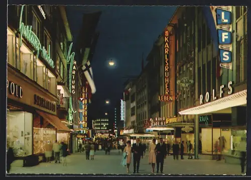 AK Kiel, Holstenstrasse bei Nacht, Leuchtreklamen, Passanten