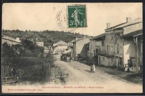 AK Moncel-sur-Seille, Route de Nancy avec vue sur la rue principale et maisons anciennes