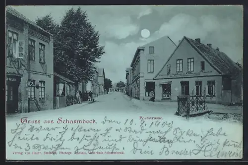 Mondschein-AK Scharmbeck, Poststrasse mit Uhren-Handlung von H. Müller