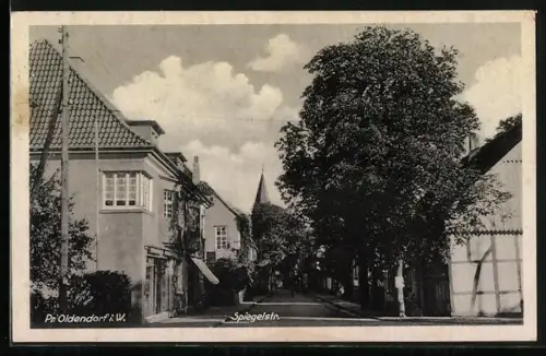 AK Pr. Oldendorf i. W., Spiegelstr. mit Kirche