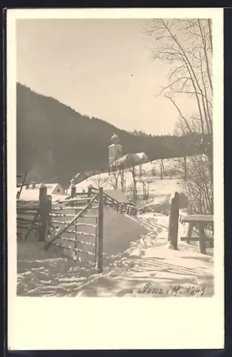 Foto-AK Stanz, Ortspartie mit Kirche im Schnee