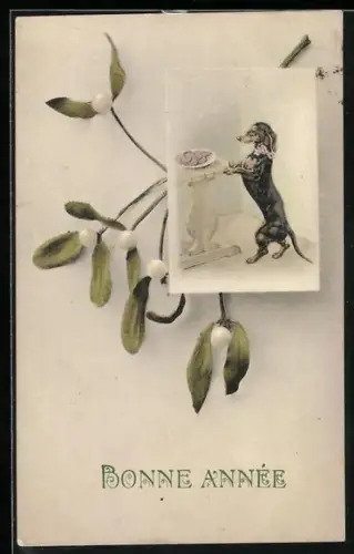 AK Neujahrsgrüsse, Dackel stellt sich an einen Tisch mit Wurstteller