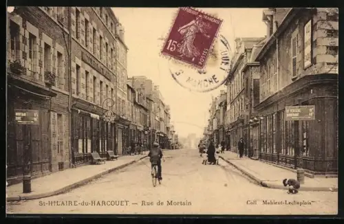 AK St-Hilaire-du-Harcouët, Rue de Mortain animée avec cycliste et passants