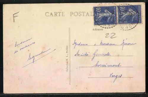 AK Glomel /C.-du-N., Le Bourg avec vue sur la rue principale et bâtiments environnants