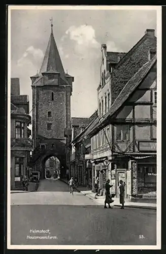 AK Helmstedt, Strassenpartie am Hausmannsturm mit Geschäften