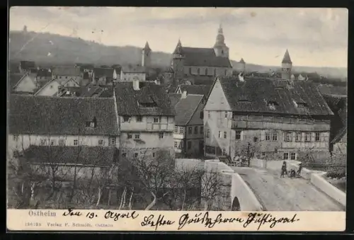 AK Ostheim / Rhön, Ortsansicht mit Blick auf die Kirche, Brücke
