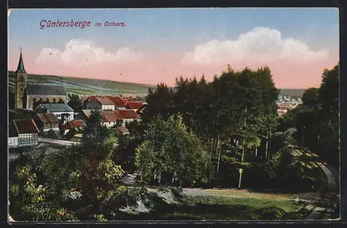 AK Güntersberge im Ostharz, Ortsansicht mit Kirche und Bahnlinie