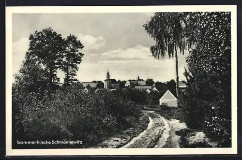 AK Schmannewitz, Dorfansicht mit Kirche und Landschaft