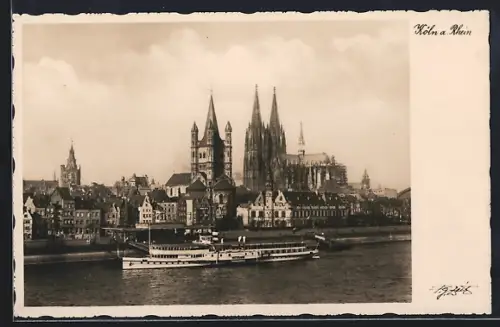 AK Köln a. Rhein, Uferpartie mit Dom und Dampfer