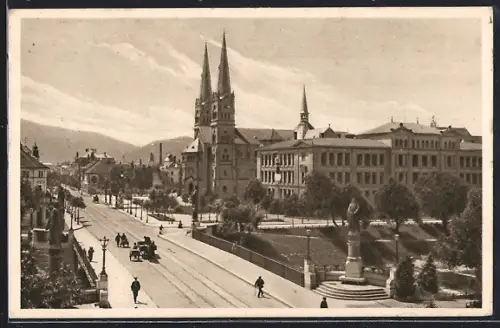 AK Freiburg i. B., Strassenpartie an der Dreisam mit Kirche und Kaiserbrücke