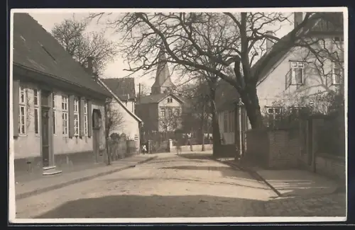 Foto-AK Bünde, Strassenblick zur Laurentinskirche