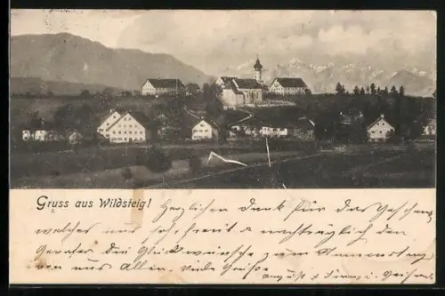 AK Wildsteig, Ortsansicht mit Kirche und Bergen
