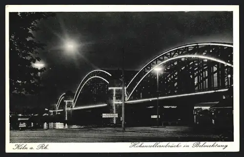 AK Köln a. Rh., Hohenzollernbrücke in Beleuchtung