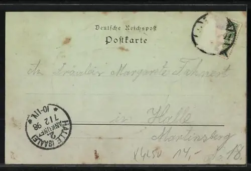 Mondschein-AK Eisleben, Strassenpartie mit Geschäft und Denkmal