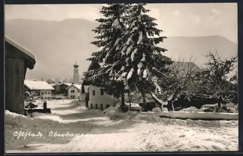 AK Ohlstadt, Winterliche Ortspartie mit Blick zur Kirche