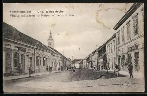 AK Weisskirchen, Kaiser Wilhelm Strasse mit Kirchturm