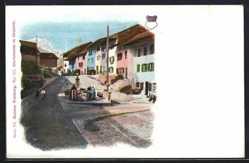 AK Gruyère, Dorfstrasse mit Wäscherinnen am Brunnen