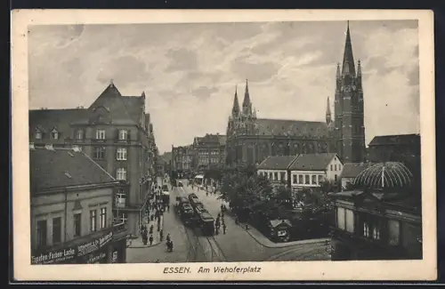 AK Essen, Am Viehoferplatz mit Tapetengeschäft, Kirche und Strassenbahn