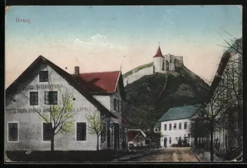 AK Doboj, Strassenpartie mit Hotel International und Schloss