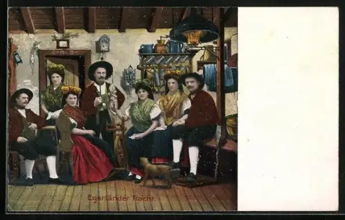 AK Frauen und Männer in Egerländer Tracht in der Stube, Tracht Sudeten