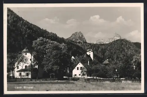 AK Landl /Ennstal, Ortsansicht mit Kirche u. Bergspitzen