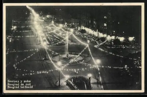 AK Belgrad, beleuchtete Strassenpartie bei Nacht