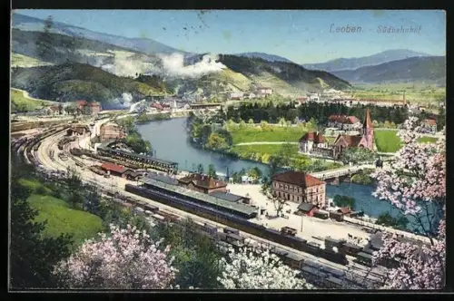 AK Leoben, Blick auf den Südbahnhof, Güterwaggons, Kirche