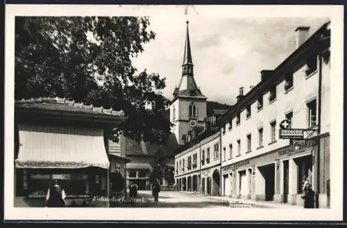 AK Fohnsdorf /Stmk., Strassenpartie mit Drogerie und Kirche