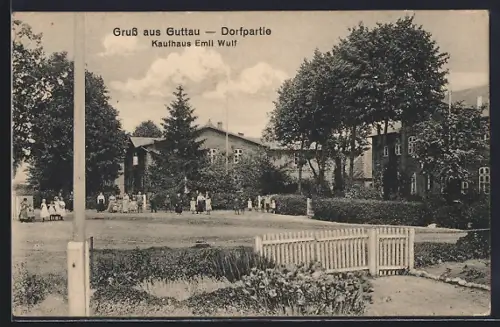 AK Guttau / Grömitz, Kaufhaus Emil Wulf, Dorfpartie